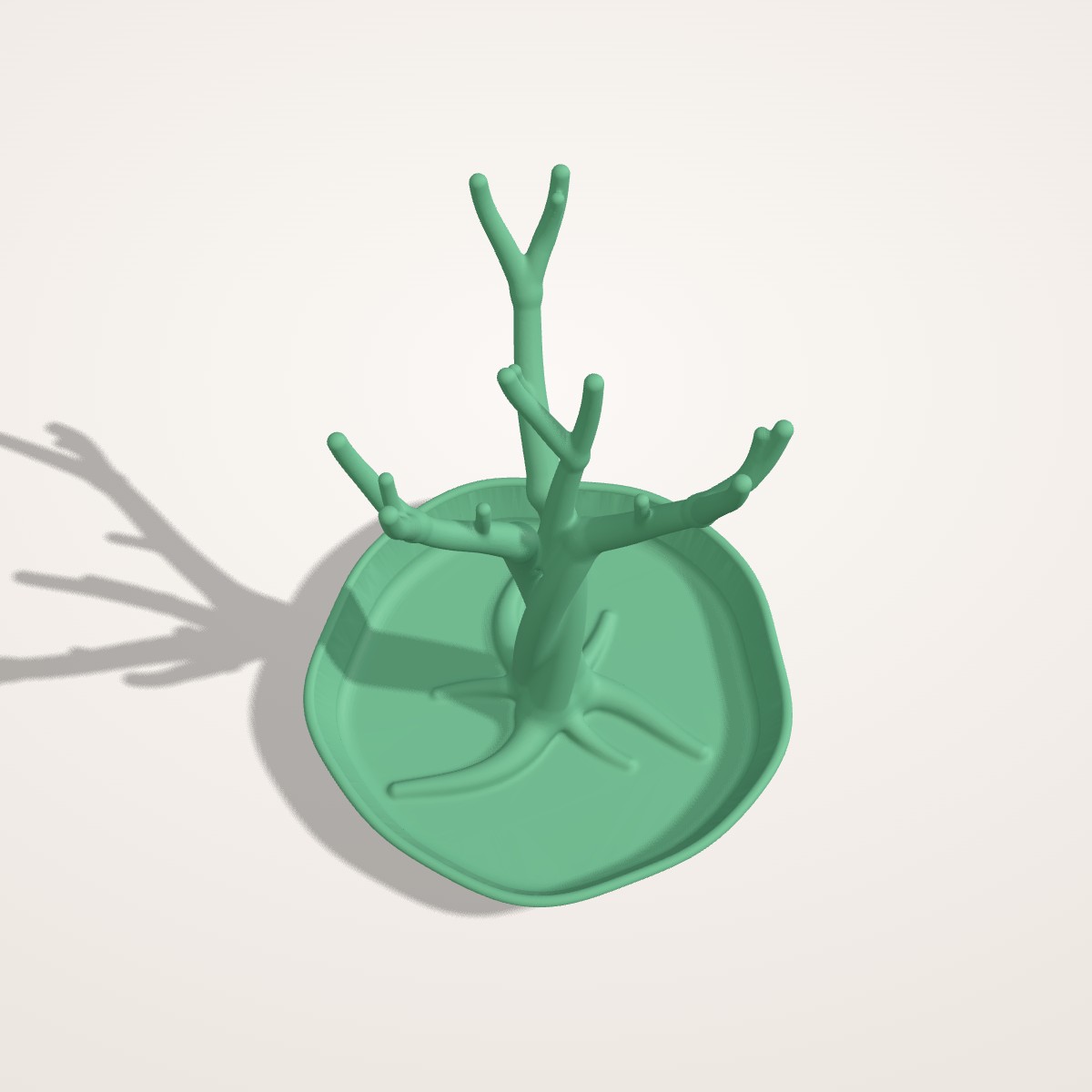 Arbre à bijoux tressé sur coupelle
